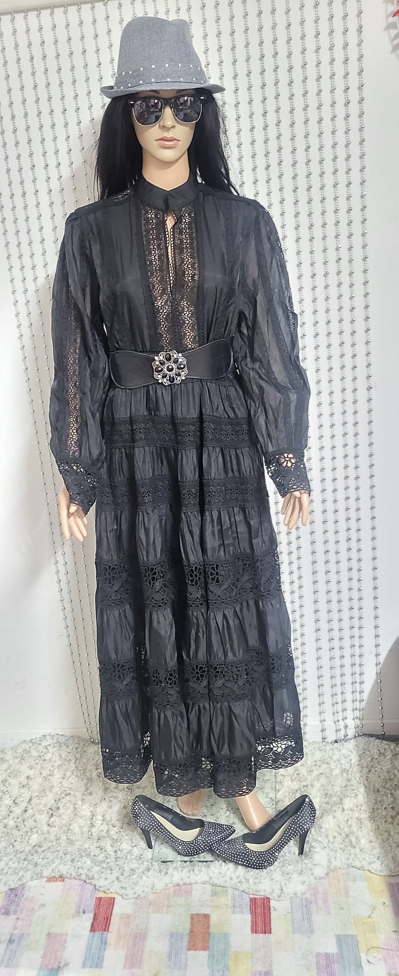 Black embroidered lace pattern dress .