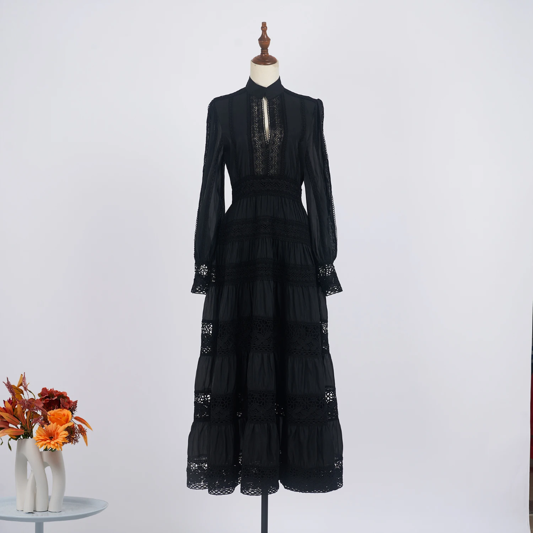 Black embroidered lace pattern dress .
